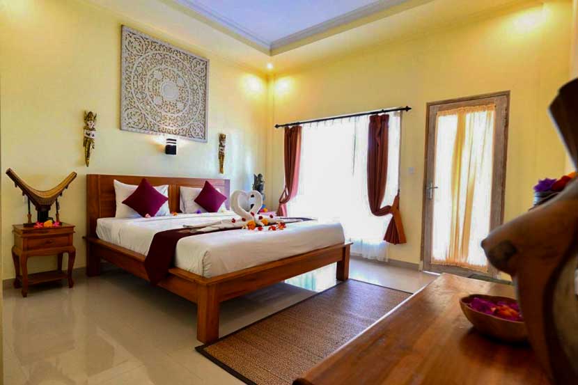 Habitación con cama doble en Vinayaka Ubud